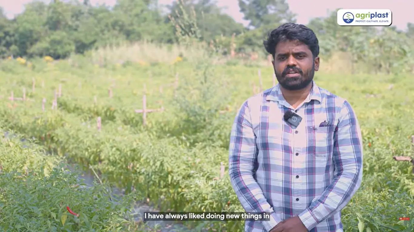 Anand Gajendrao Barbudde, chilli and vegetable farmer from Amravati, Maharashtra, standing on his farm